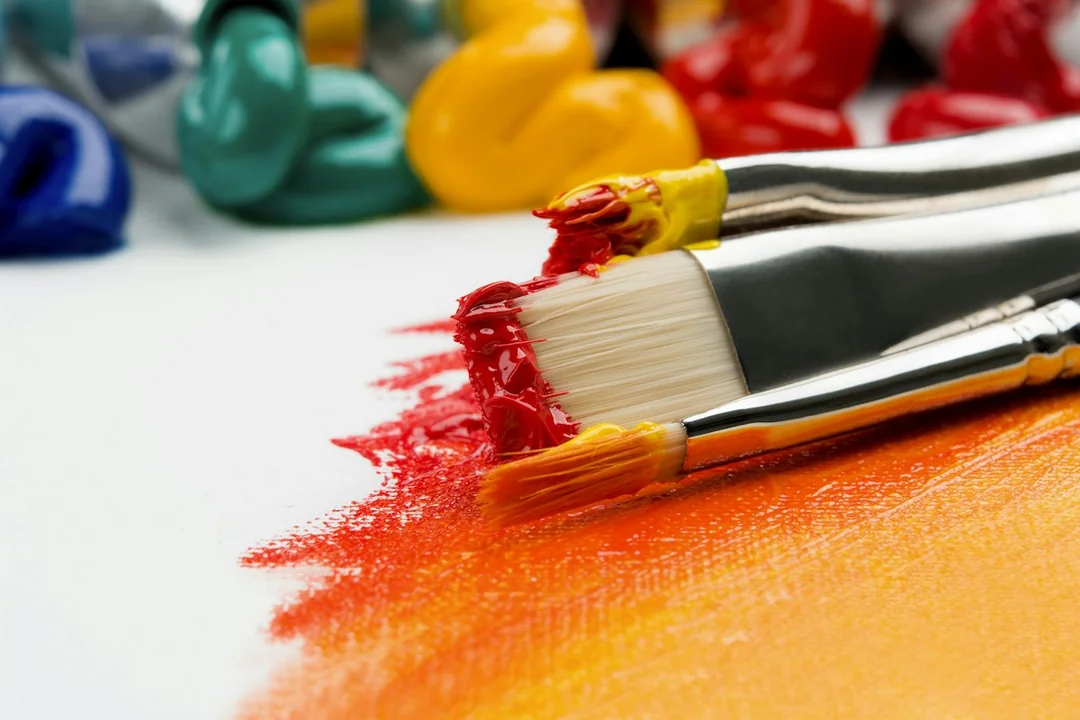Paintbrushes and colorful painting materials