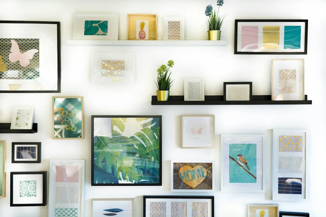 Framed illustrations and pictures displayed on a wall