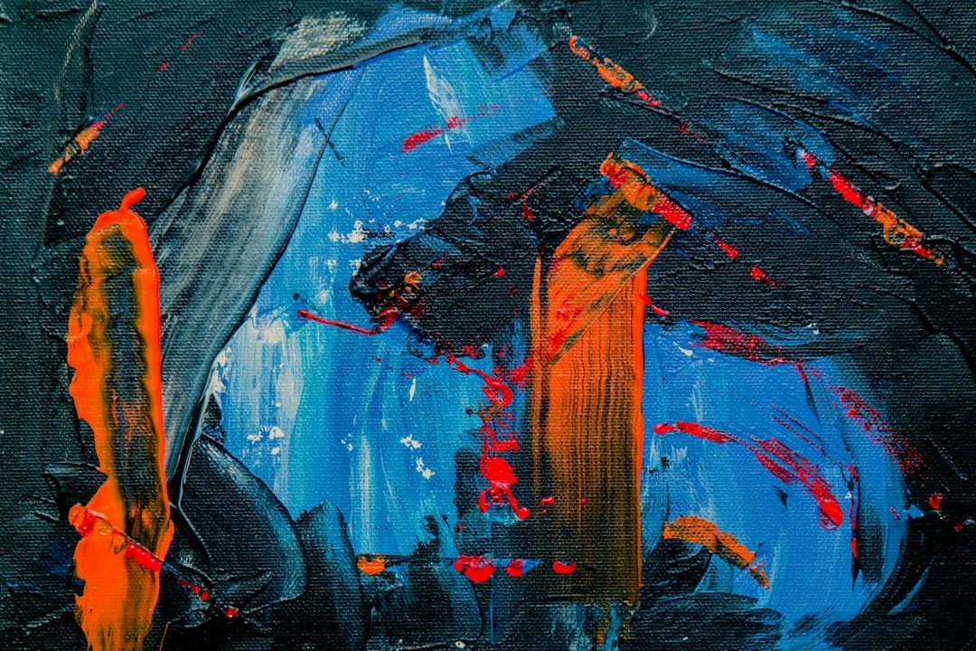 Textured blue and orange paint on a canvas